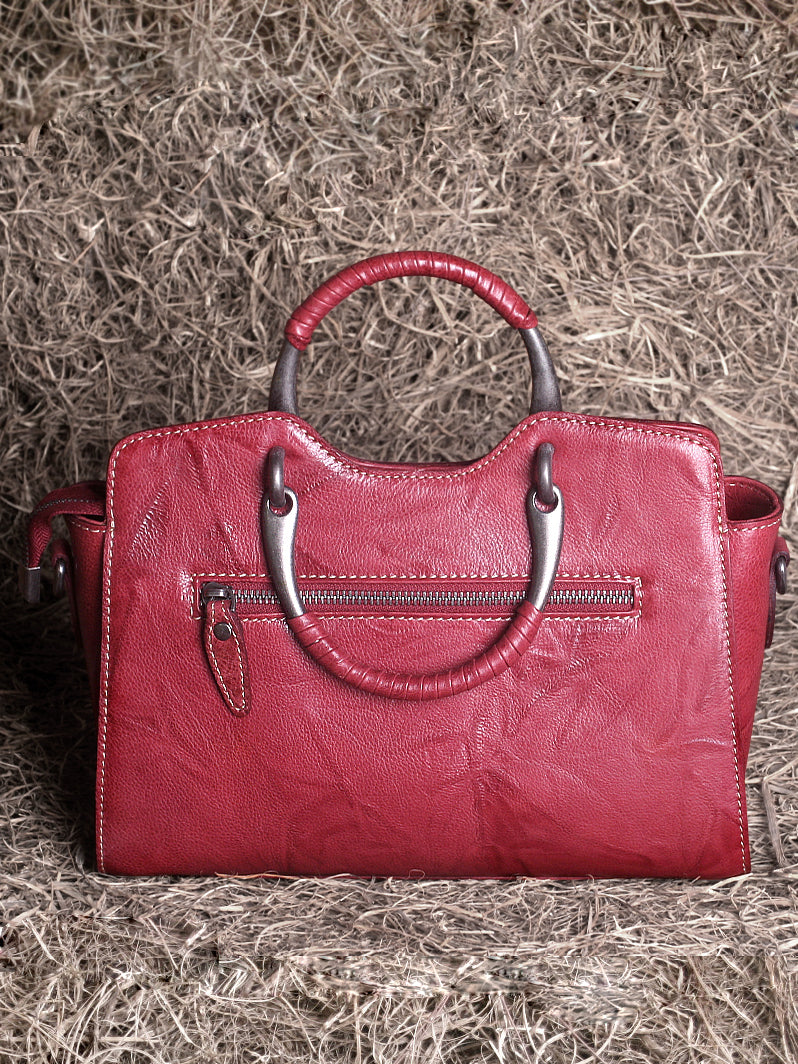 Elegant Leather Winged Tote – Women’s Full-Grain Handbag with Metal Top Handles & Compartments